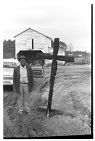 African American man standing next to a cross